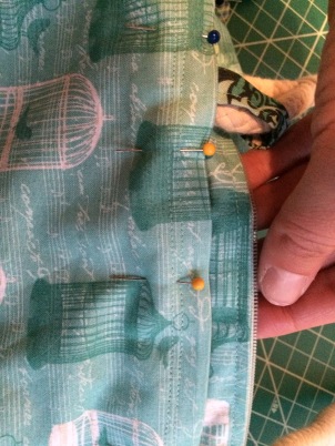 At that point, I carefully pinned and sewed the fabric into the purse, which made it easier to keep the zipper even.